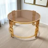 ترابيزة قهوة أنيقة ستانلس ستيل ذهبي، سطح زجاجي دائري فيميه عسلي، تصميم عصري، ديكورات منزلية فاخرة