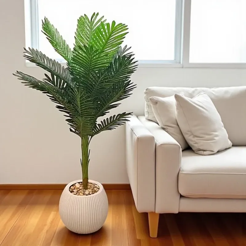 نخلة أريكا اصطناعية فاخرة في إناء بيج بتصميم مميز مع حصى بيضاء، مناسبة لديكور المنزل والمكتب