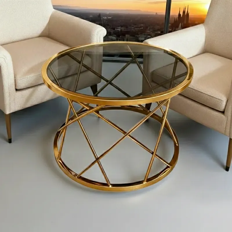 ترابيزة قهوة مستديرة ستانلس ستيل ذهبية فاخرة بتصميم هندسي و سطح زجاجي مدخن