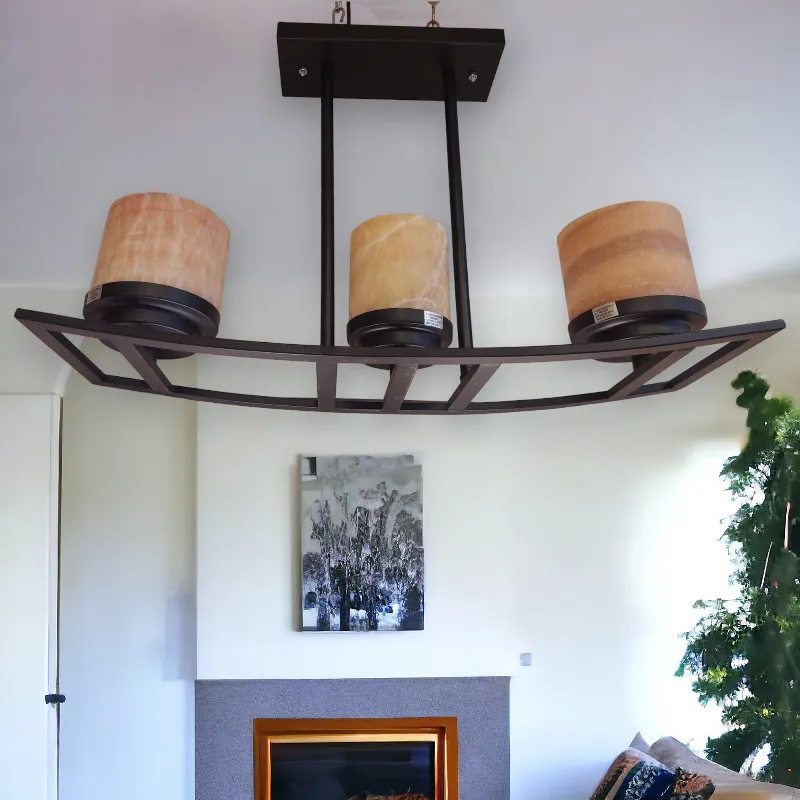 نجفة كلوبات فيرفورجيه مضاءة داخل غرفة ويوجد زرع بالأسفل وصور على الحائط موديل 019652