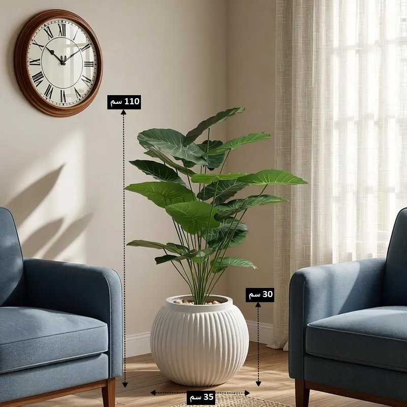شجرة بوتس صناعية بارتفاع 110 سم وأصيص أبيض مضلع قطر 35 سم وارتفاع 30 سم بين كرسيين زرقاوين